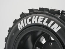 Load image into Gallery viewer, Best rc car tire / wheel sticker decals on the market. Made to fit BRP tires. Includes (8) stickers: &quot;Michelin&quot; Logo. Does not include BRP knobby tire. This vinyl is long-lasting, specially made for vehicles, and has permanent adhesive properties. Clear transfer tape is on top of the vinyl, to allow seamless transfer to your tires.  Refer to these dimensions to determine fitment: Stickers are 7/16 inch tall, and curved for a 4-1/4 inch diameter rim.
